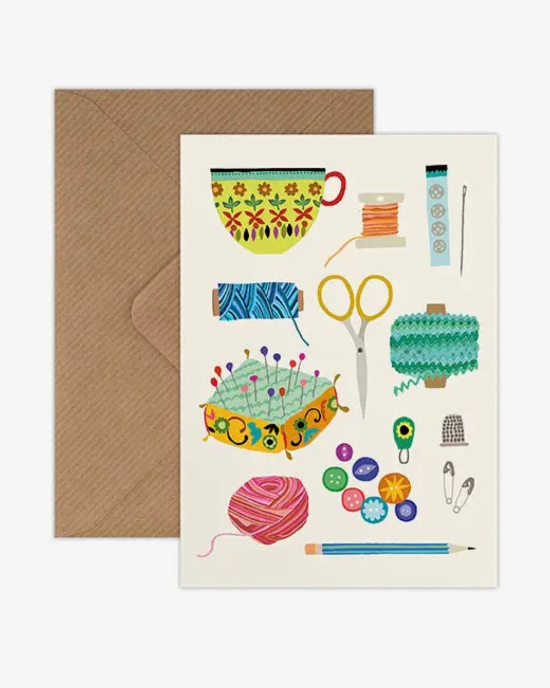 Greeting card with sewing & knitting-themed illustrations and a brown envelope on a white background