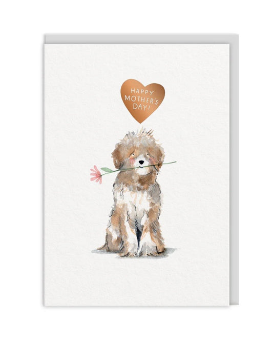 Card with a dog holding a flower and a heart-shaped 'Happy Mother's Day' on a white background