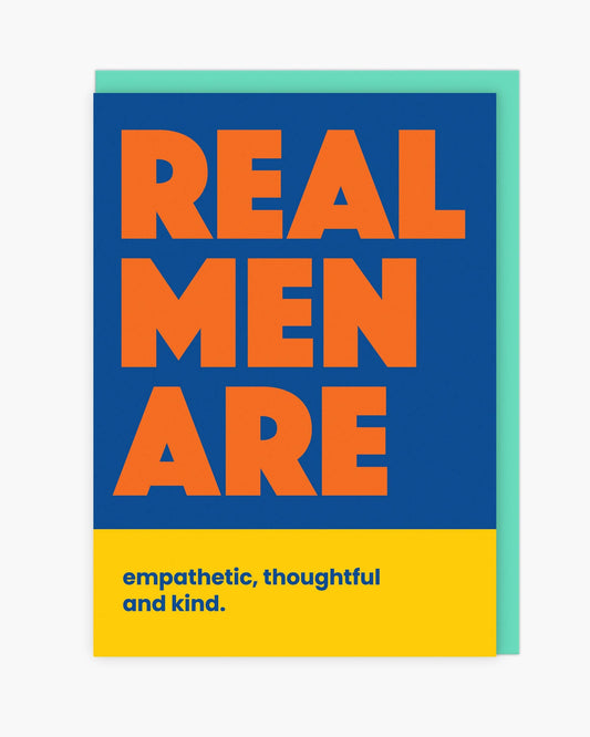 Greeting card with 'Real Men Are' text on a blue, green, and yellow background
